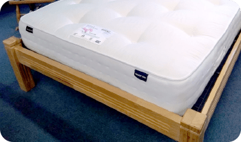 Light wood finish on a single bed